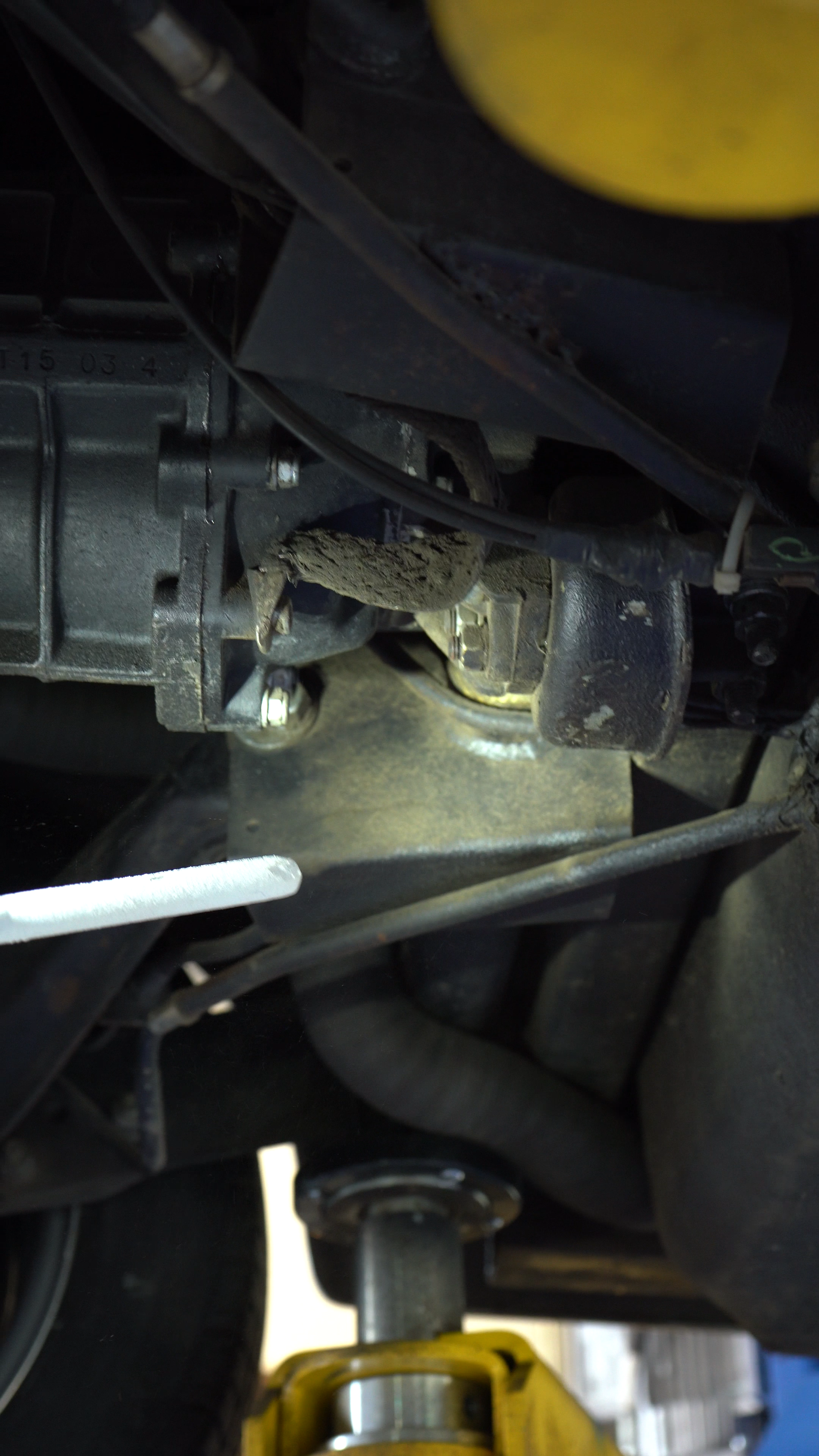 Close up of the dirty undercarriage of a car